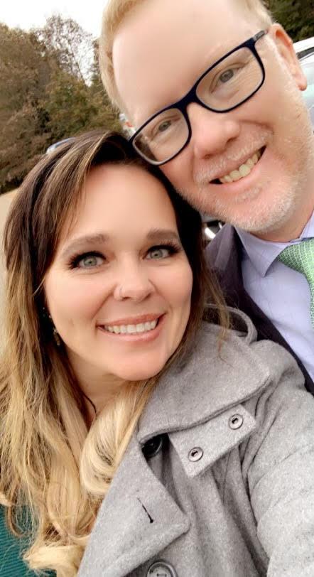 Smiling couple selfie outdoors wearing coats Smiling couple selfie outdoors wearing coats
