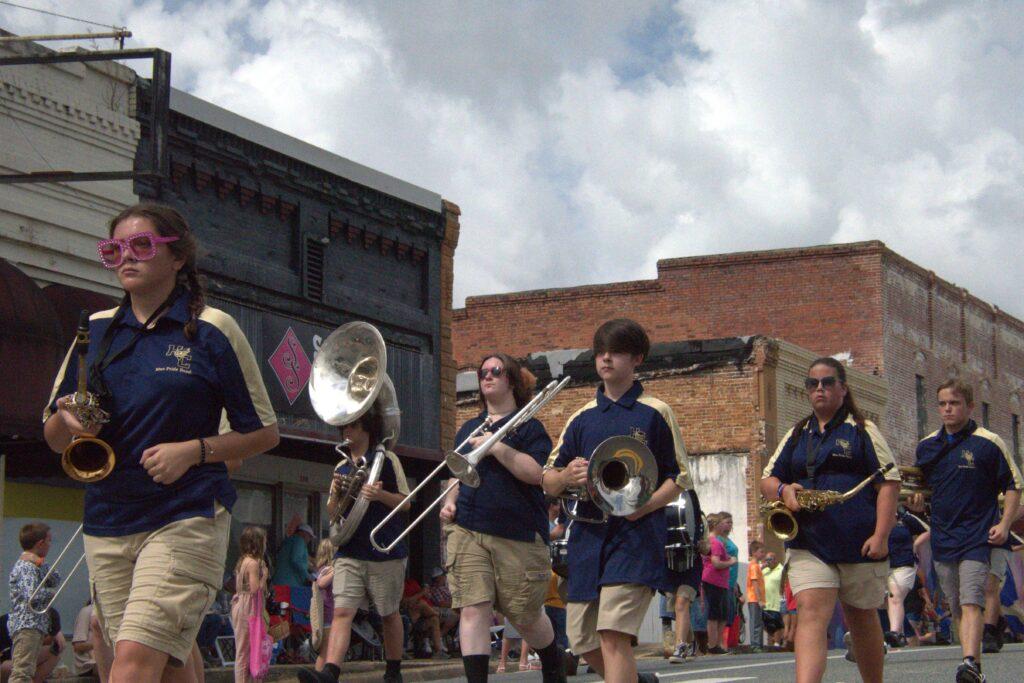 A group of people in uniform playing instruments.