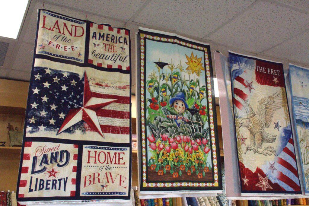 A wall with many different pictures of patriotic designs.