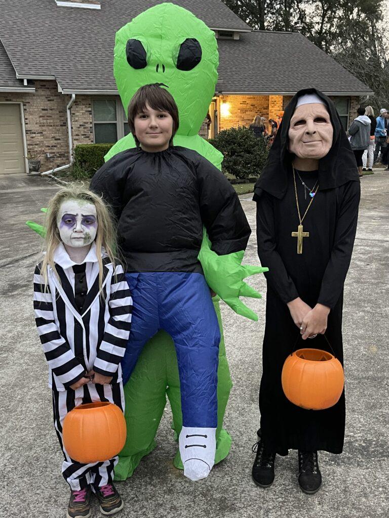 A group of people in costumes posing for the camera.