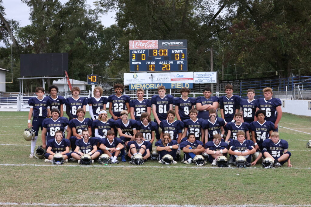 A group of young men in football uniforms.