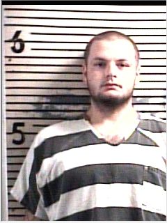 Mugshot of man in striped jail uniform Mugshot of man in striped jail uniform